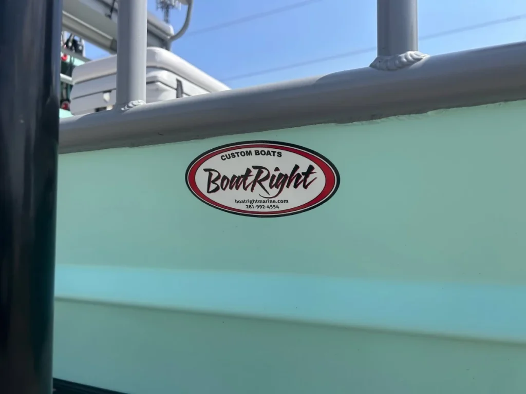 Boat Right Custom Boats oval decal on a seafoam hull