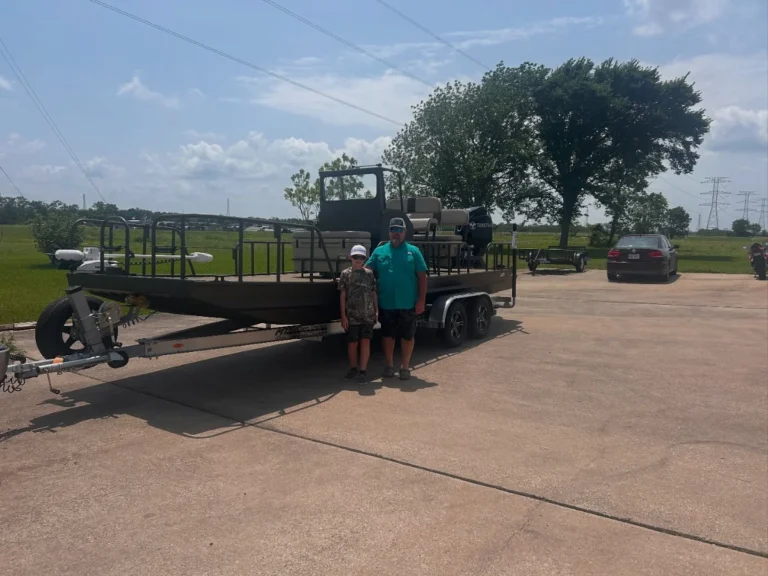 Two owners with their dark Boat Right