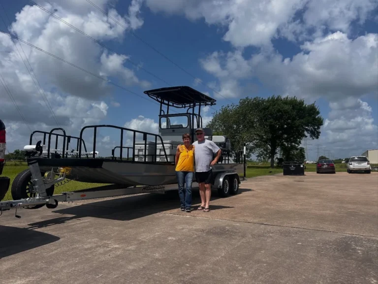 Two owners with their gray Boat Right and its T-top