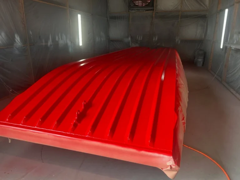 Hull bottom painted red in the paint booth