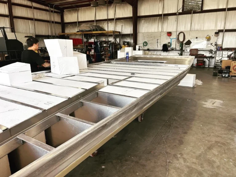 Foam flotation blocks set between the floor frames of a hull