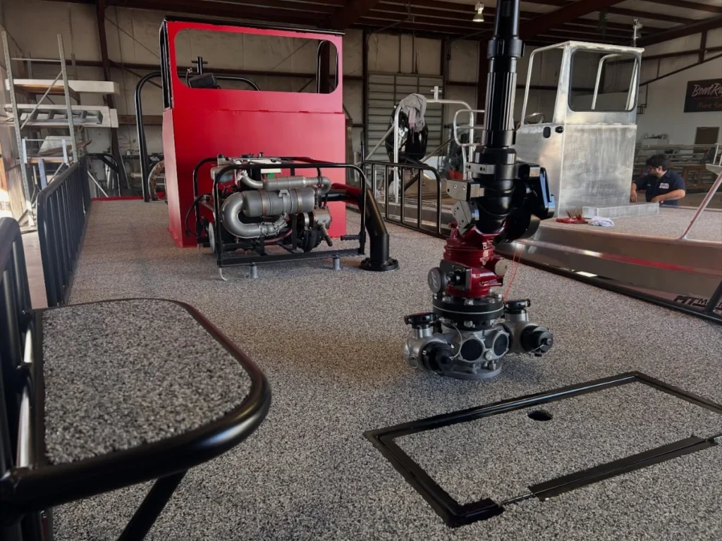 Pump and water monitor on the deck of a red Boat Right fire and rescue boat