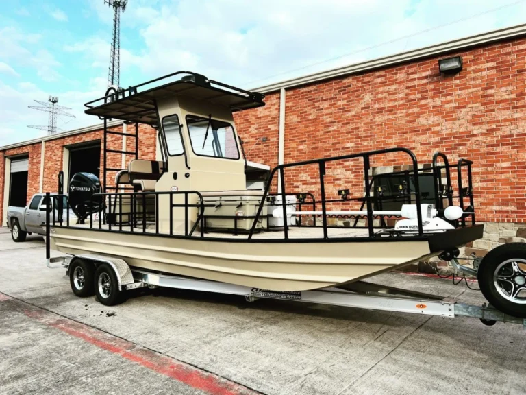 Tan Boat Right with an enclosed helm