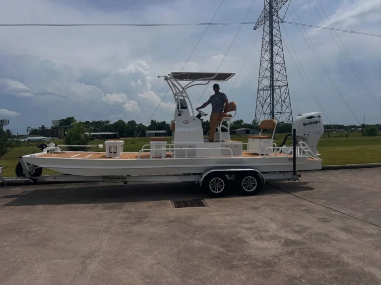 Owner aboard his white Boat Right on its trailer